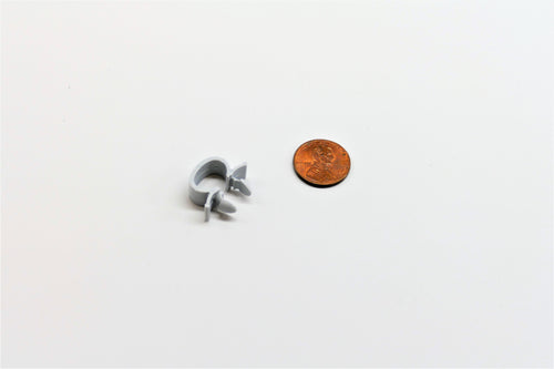 A 10mm grey harness clip for porsche 928s.