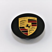 A gloss black painted crest for Porsche 928s. 